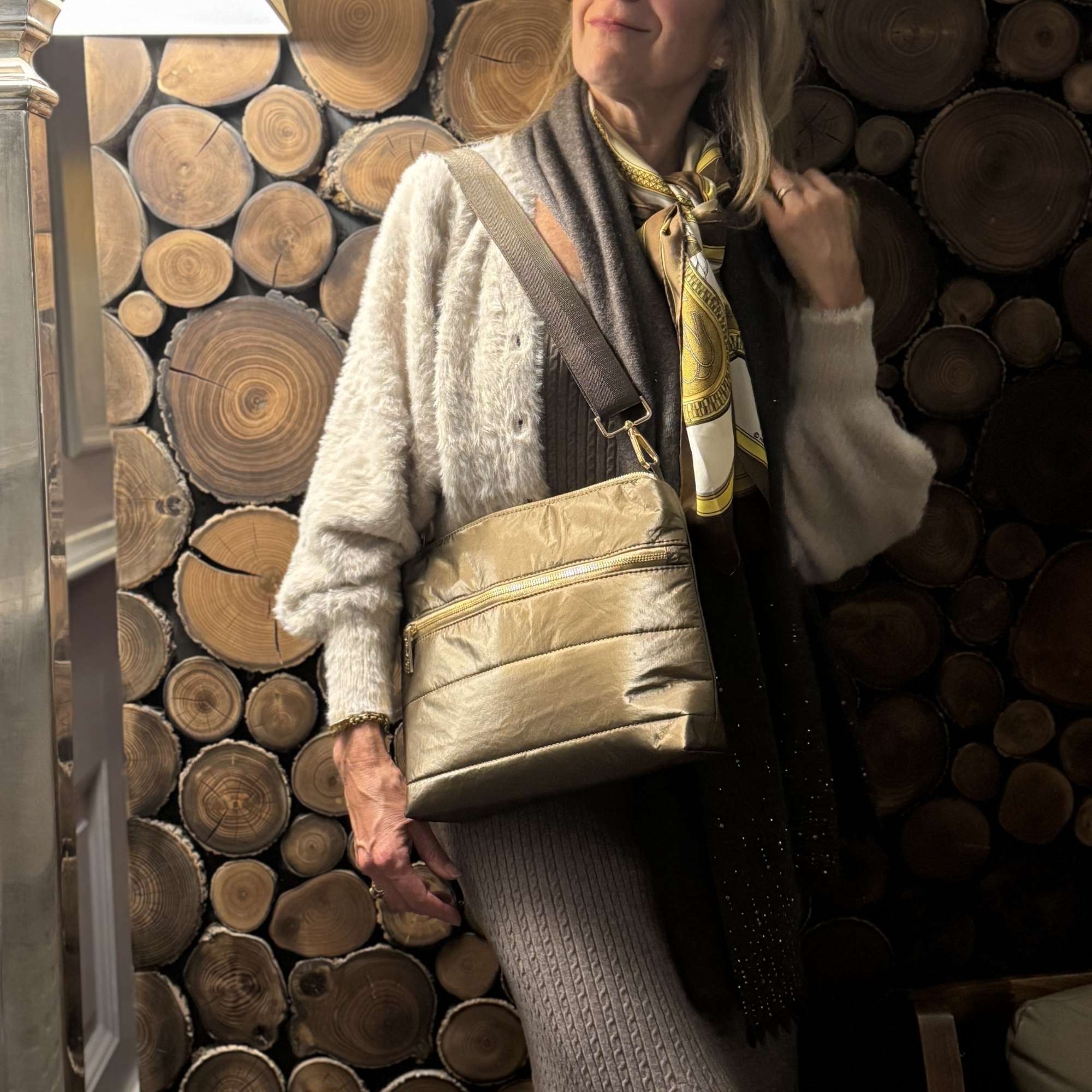 Woman wearing Quilted Shoulder Bag in Shimmer Bronze with Gold Zipper