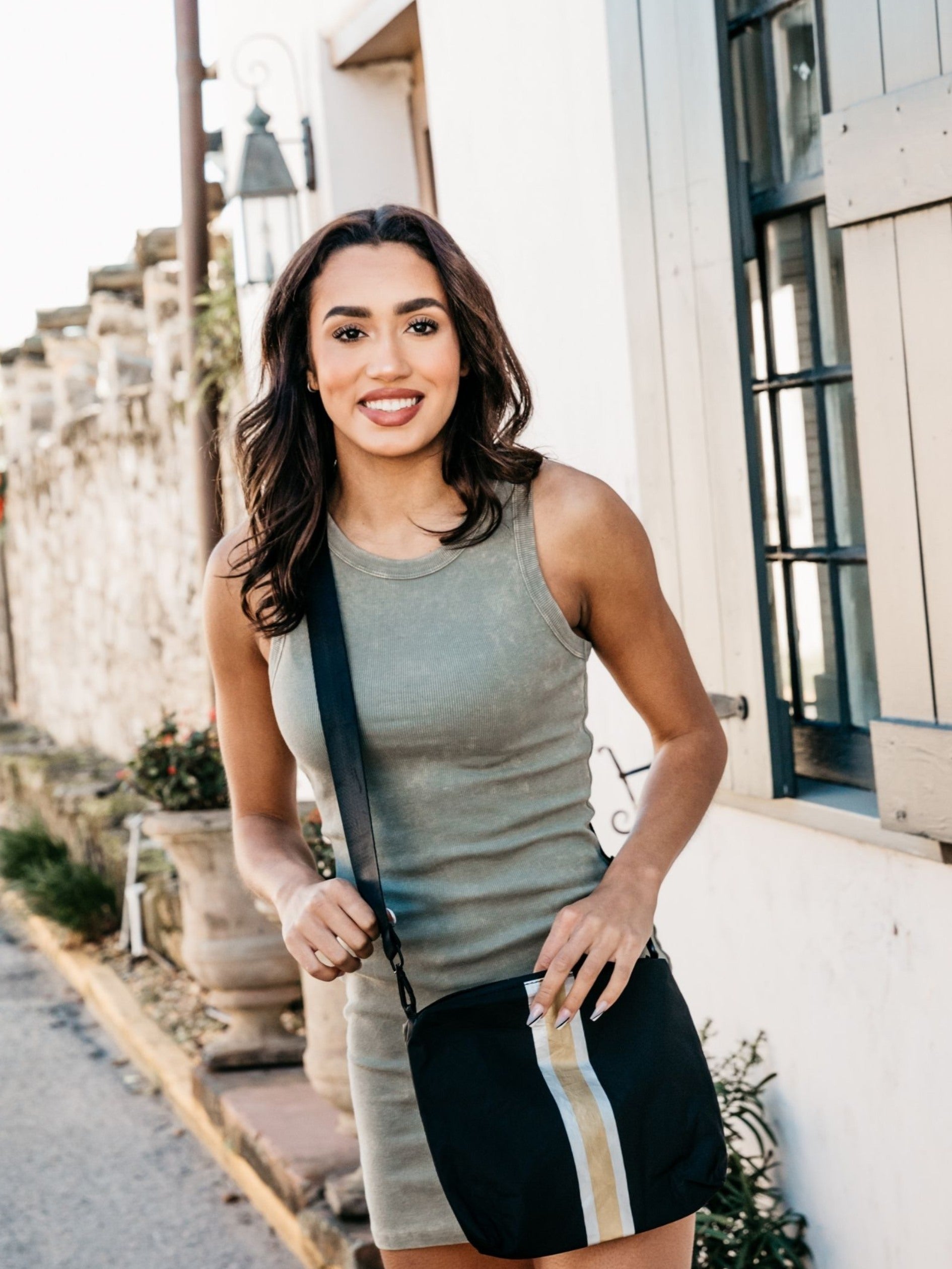 Crossbody purse in black with silver and gold stripes