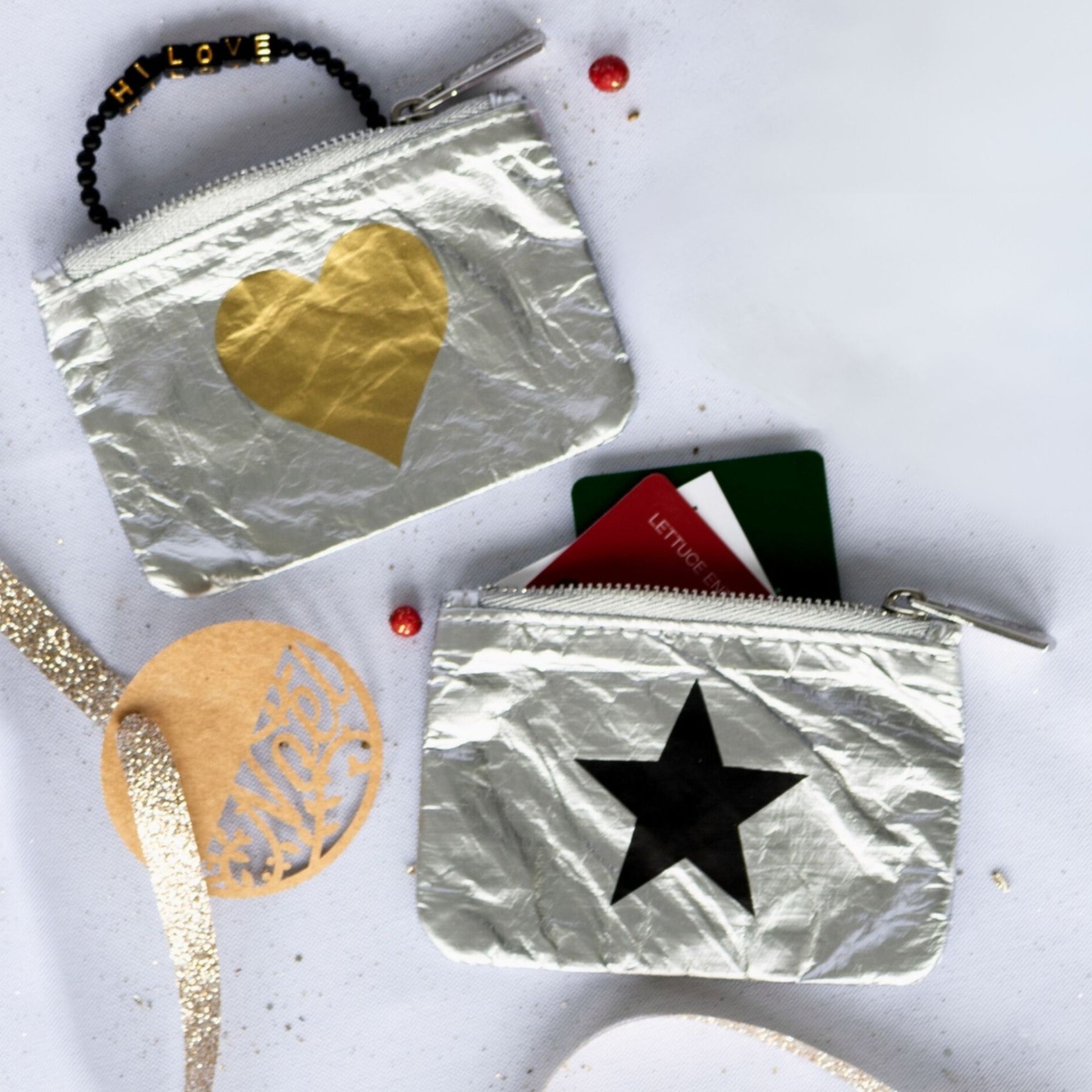 Emergency pouches in silver with gold heart and black star