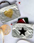 Emergency pouches in silver with gold heart and black star