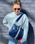 Crossbody purse in shimmer navy with white stripes