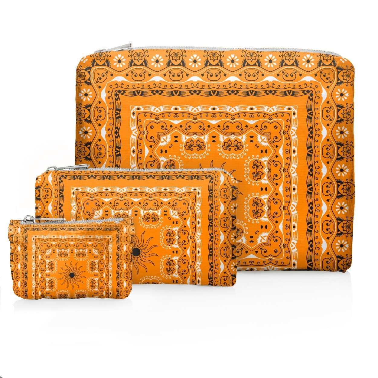 Set of three orange bandana patterned pouches on a white background