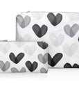 Set of Two Zip Pouches in Language of Love Black and White Heart Print on white background.