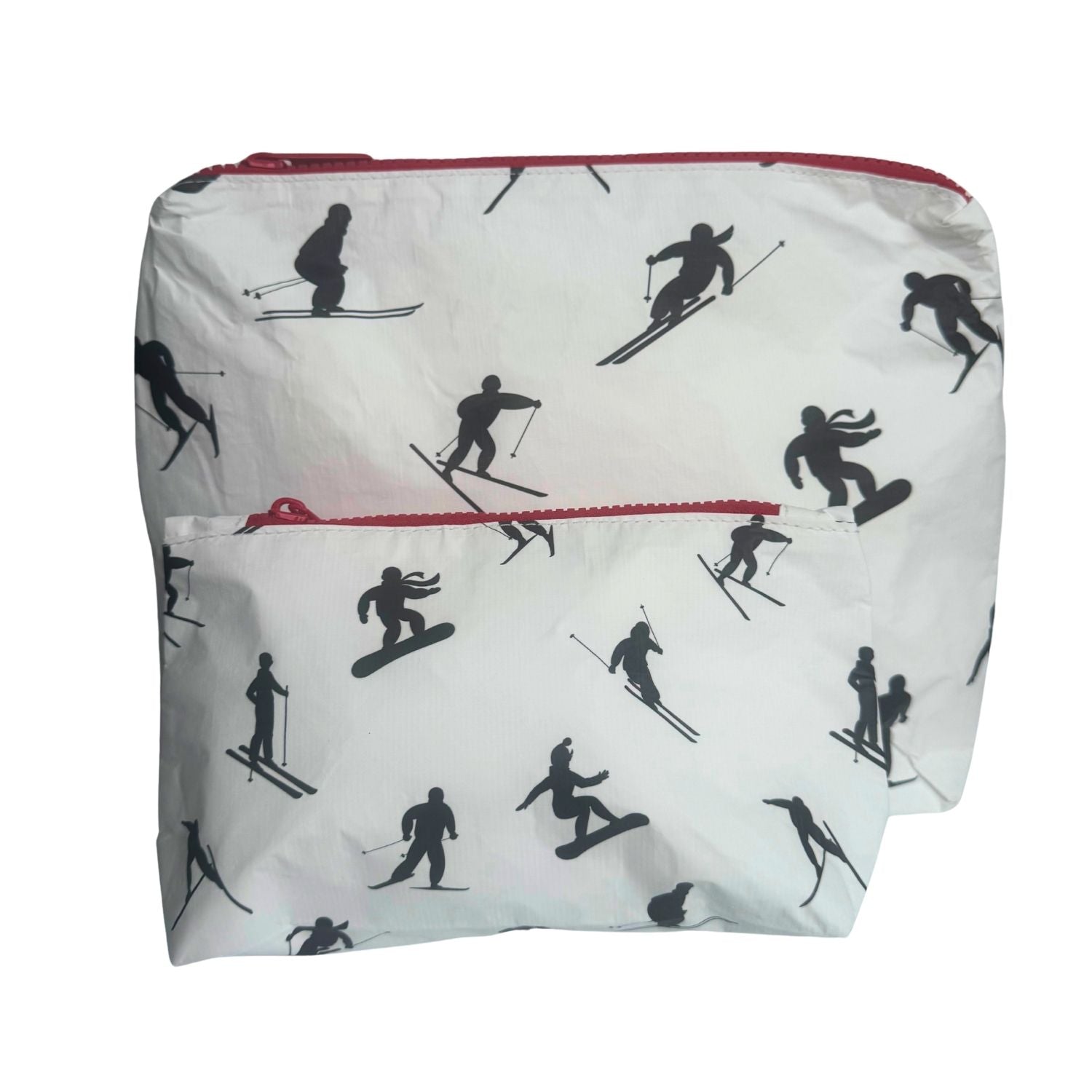A white reusable bag with a black ski and snowboarder silhouette pattern and red zipper accents, shown against a plain white background.
