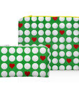 Two green pouches with white golf balls and red hearts on a white background
