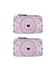 Two pink coin purses with black and pink heart bandana print on a white background