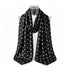 Signature Silk Scarf in black featuring the exclusive Signature Hi Print with hearts, moons, stars, and H! icons on white background