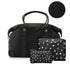 A black duffel bag with signature print handles and side trim, shown with two matching zip pouches in front. The pouches have a white star and moon pattern, and a circular inset at the top shows a close-up of the black patterned strap detail.