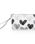A white zipper pouch with a wristlet strap, decorated with a pattern of hand-drawn watercolor hearts in black, gray, and light gray, shown on a white background.