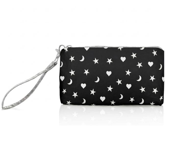 Black zip wristlet with white star, moon, and heart pattern on a white background