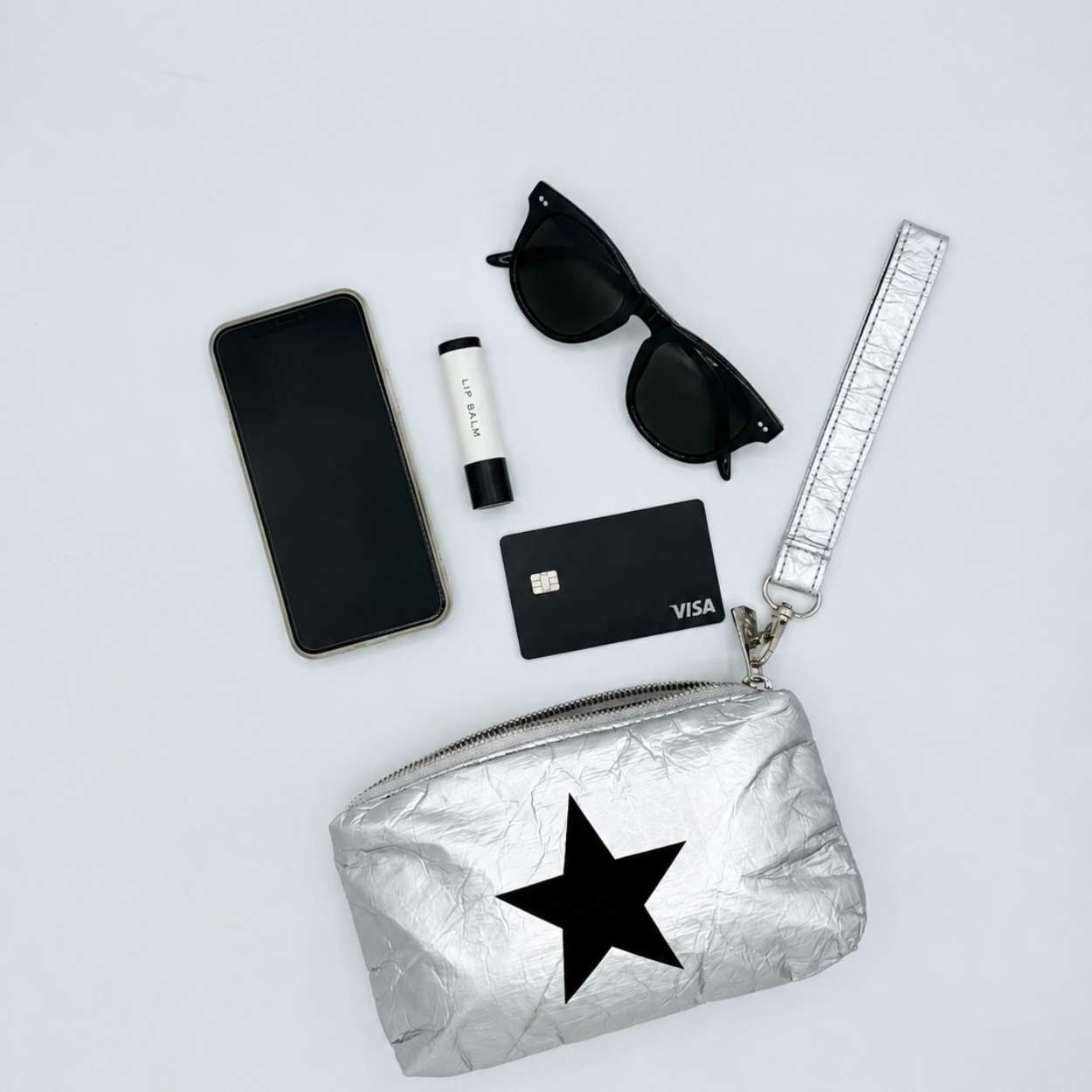 Wristlet Silver Black Star with phone, sunglasses, lip balm and credit card