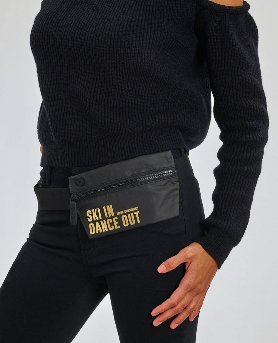 women wearing a black belt bag across the waist that has a custom printed logo on it in gold.