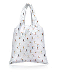 White reusable bag with small printed golfers on a white background