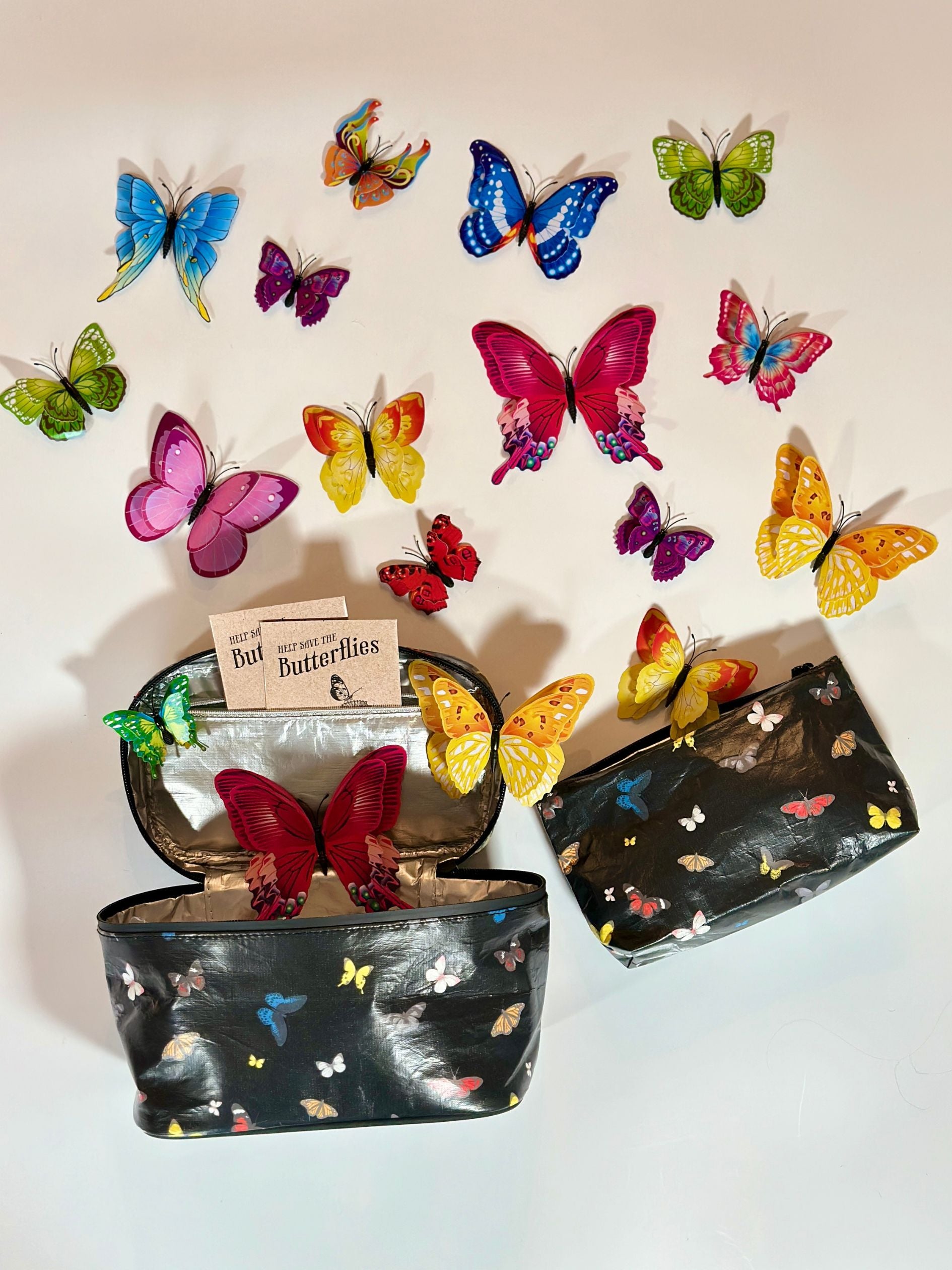 Butterfly-themed pouches with decorative butterflies on a white background
