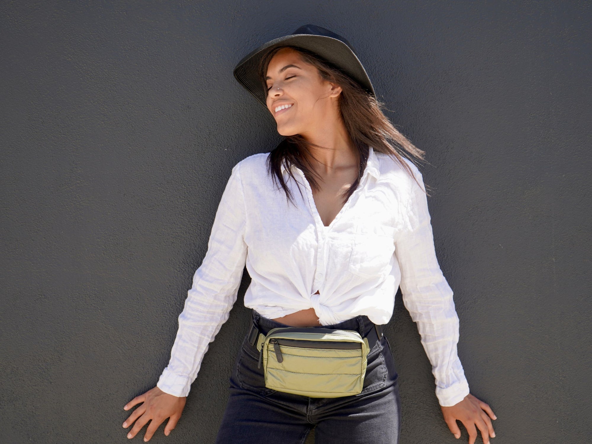 Woman wearing Puffer Crossbody Fanny Pack Belt Bag in Shimmer Olive Green