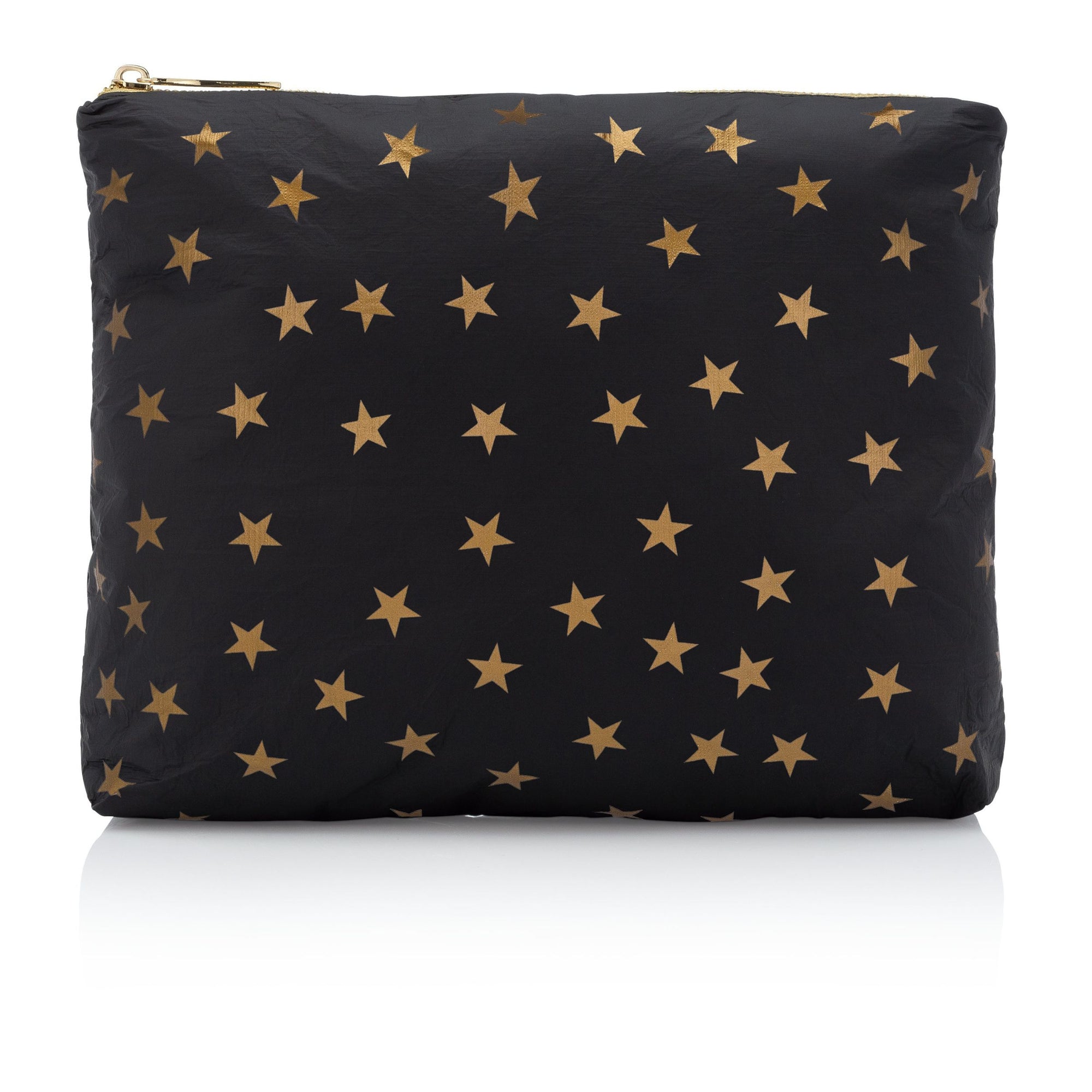 medium zipper pouch in black with myriad of gold stars on white background