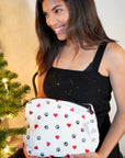 Lightweight medium zipper pack in paw prints and hearts pattern