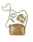 Gold mini zipper pouch and lipstick coming out of gold mini puffer clutch with gold chain 