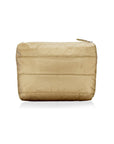 A gold-colored clutch bag with a smooth texture, featuring a foldover closure with a magnetic fastening and an exterior zipper pocket.