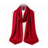 A vibrant red scarf with a repeating H signature pattern, draped on a clear mannequin torso against a solid white background.