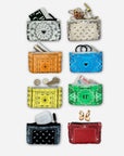 Collection of colorful bandana-patterned pouches in white, orange, beige, blue, yellow, green, black, and red and accessories on a white background 