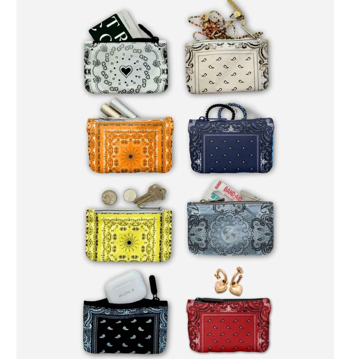 Eight small zip pouches or coin purses arranged in a grid on a light gray background. Each pouch has a different decorative bandana-style print in various colors, including black, beige, orange, navy blue, yellow, light blue, white, and red.