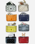 Eight small zip pouches or coin purses arranged in a grid on a light gray background. Each pouch has a different decorative bandana-style print in various colors, including black, beige, orange, navy blue, yellow, light blue, white, and red.