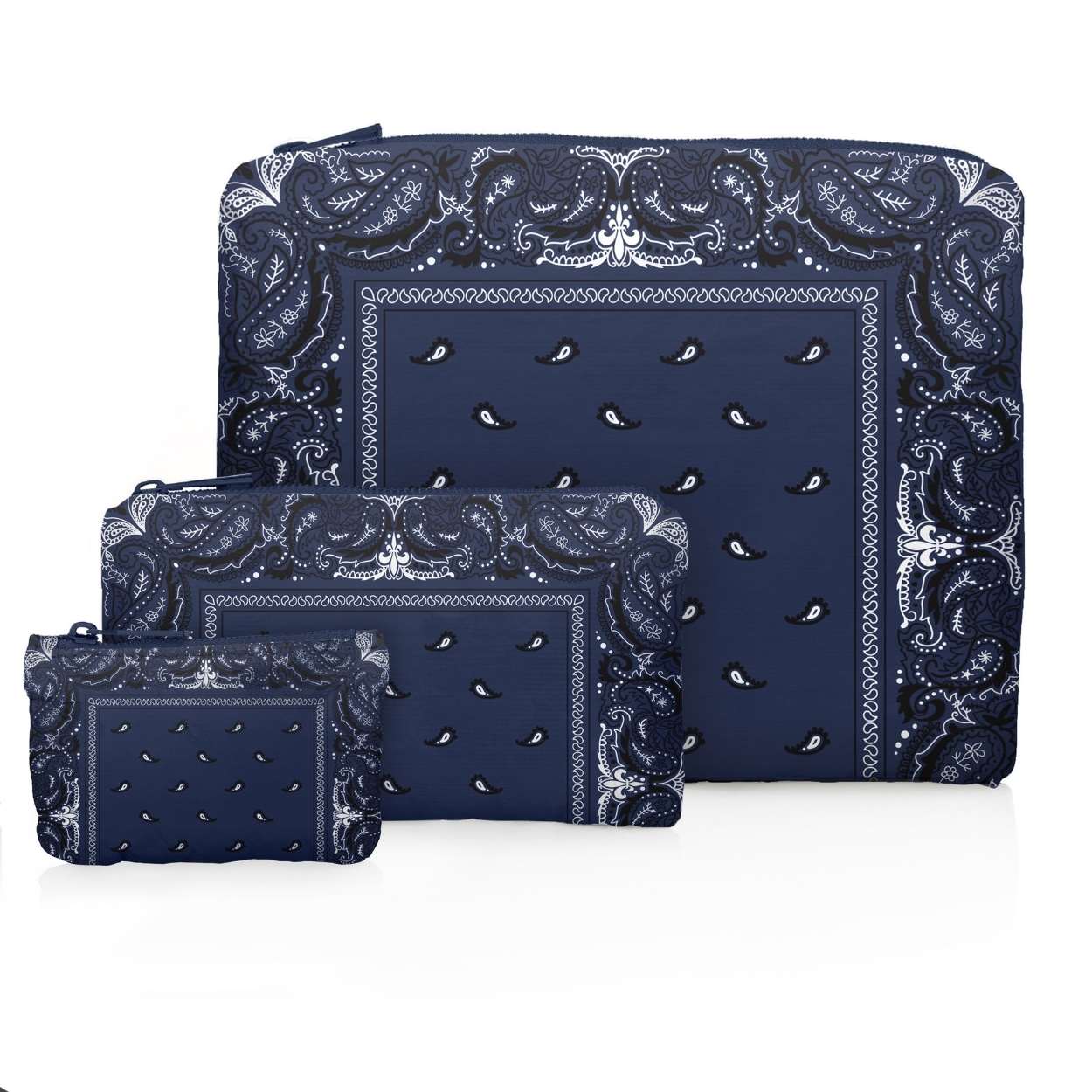 Set of three zipper pouches in navy bandana print on a white background
