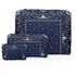 Set of three zipper pouches in navy bandana print on a white background