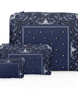 Set of three zipper pouches in navy bandana print on a white background