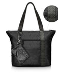 Black signature travel tote with a matching mini pouch, both featuring the brand's signature striped pattern, detail inset shown.