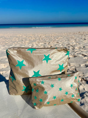 Shimmer beige zipper pouch set with turquoise stars on the beach