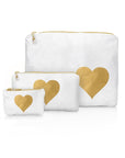 Set of three white pouches with gold hearts on a white background