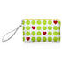 A small zip pouch with a wrist strap with green tennis balls and red hearts pattern and a yellow zipper.