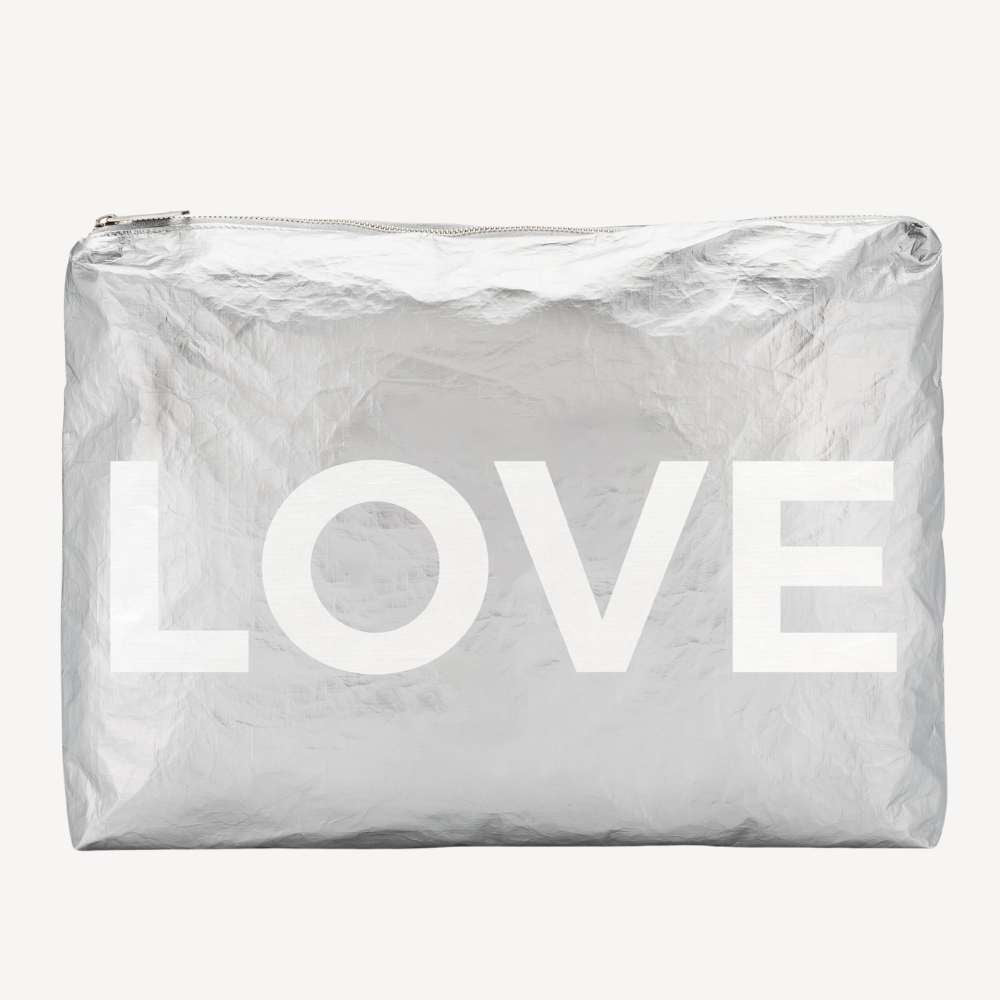 Silver pouch with 'LOVE' printed on it against a white background
