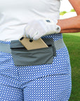 Person on golf course wearing Layflat Fanny Pack Belt Bag in Cool Gray
