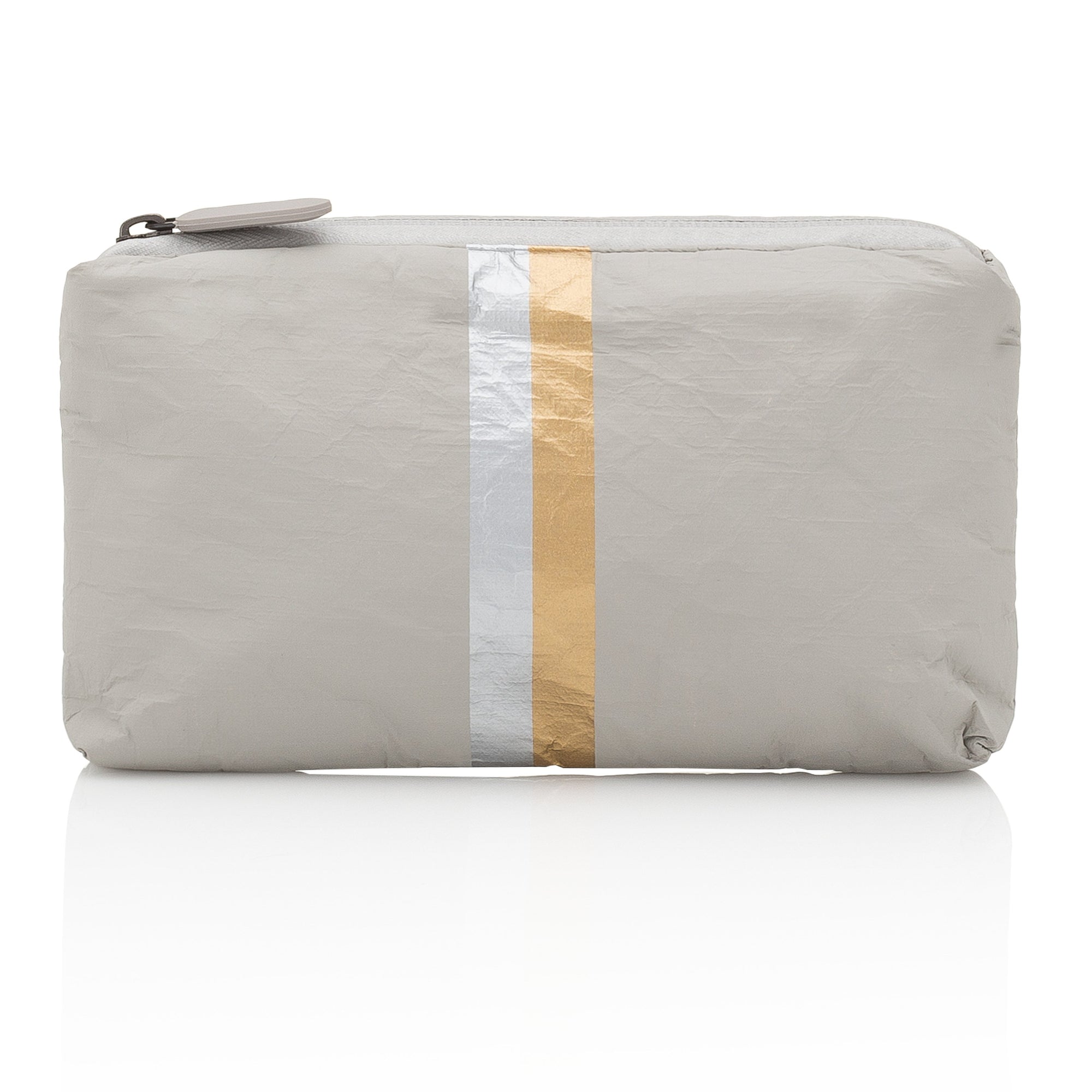 A gray travel pouch with vertical silver and gold stripes, featuring a zipper closure.