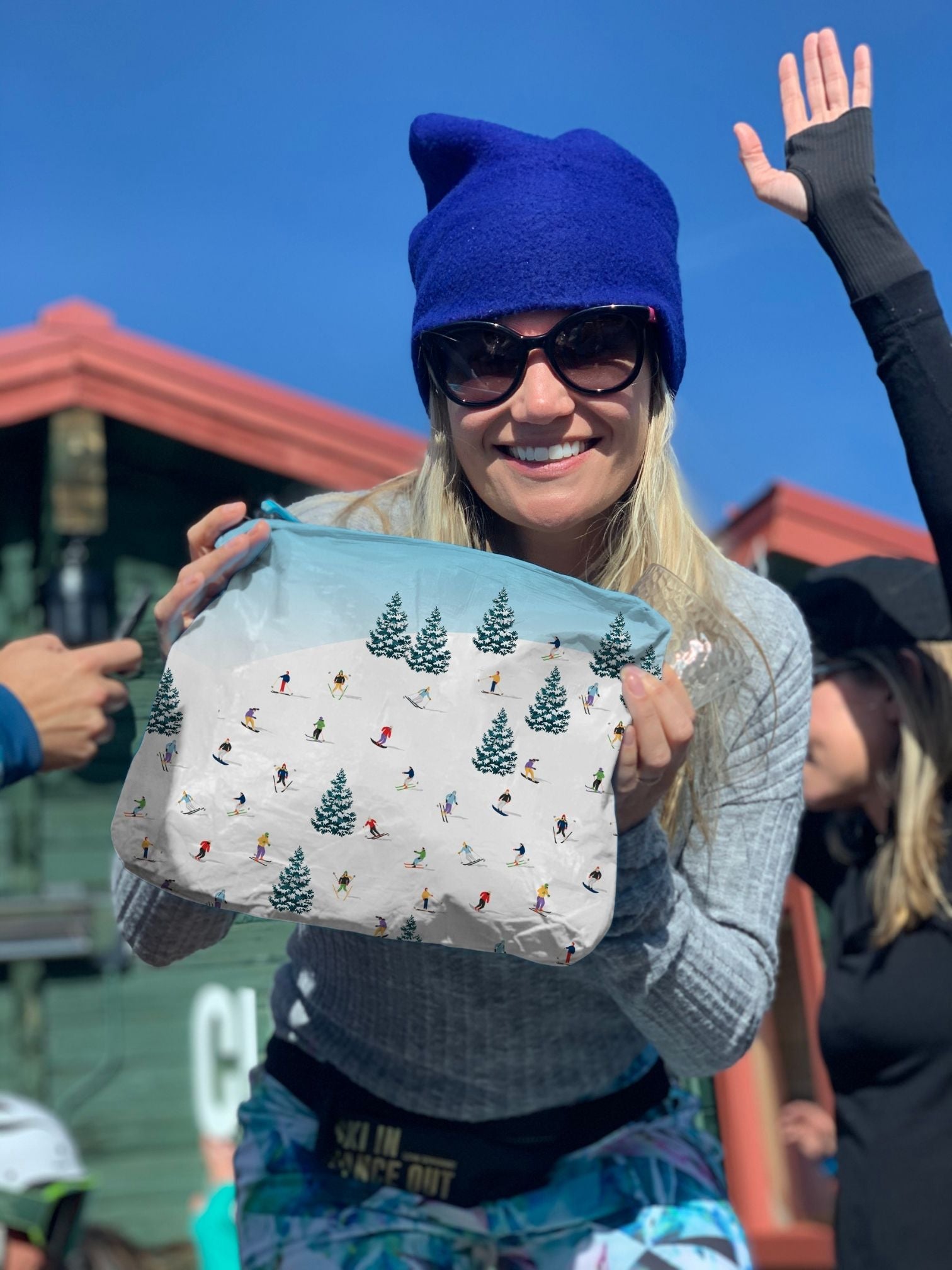 Woman using Medium Zipper Pouch in Skiers Pattern