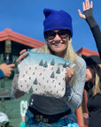Woman using Medium Zipper Pouch in Skiers Pattern