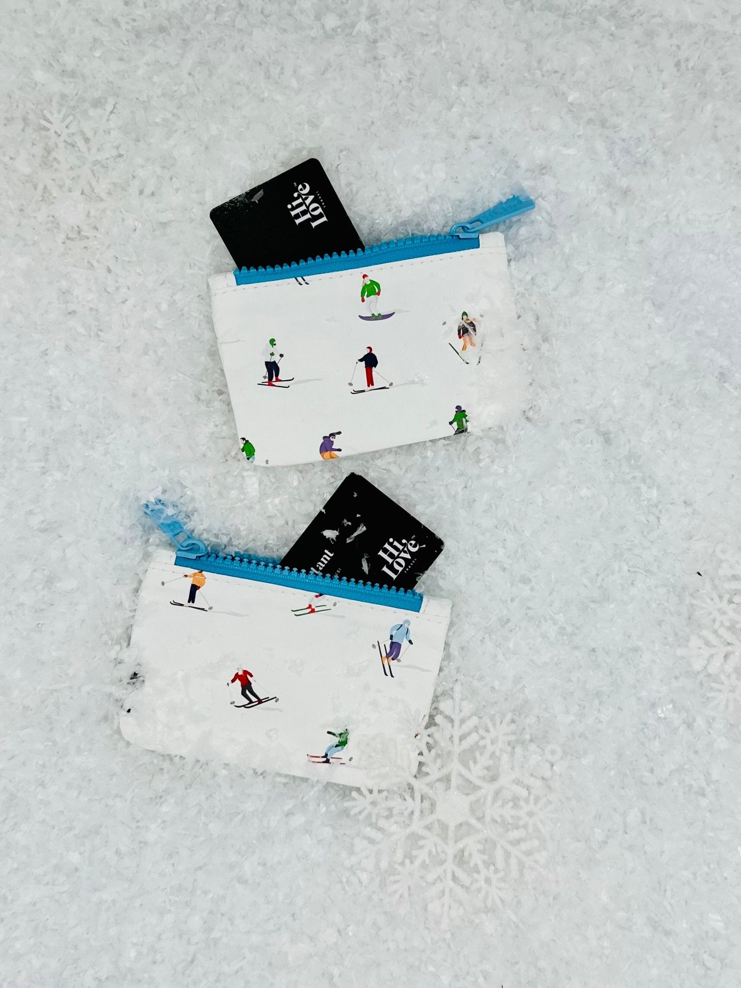 Small pouch set of two in dancing skier and snowboarder pattern