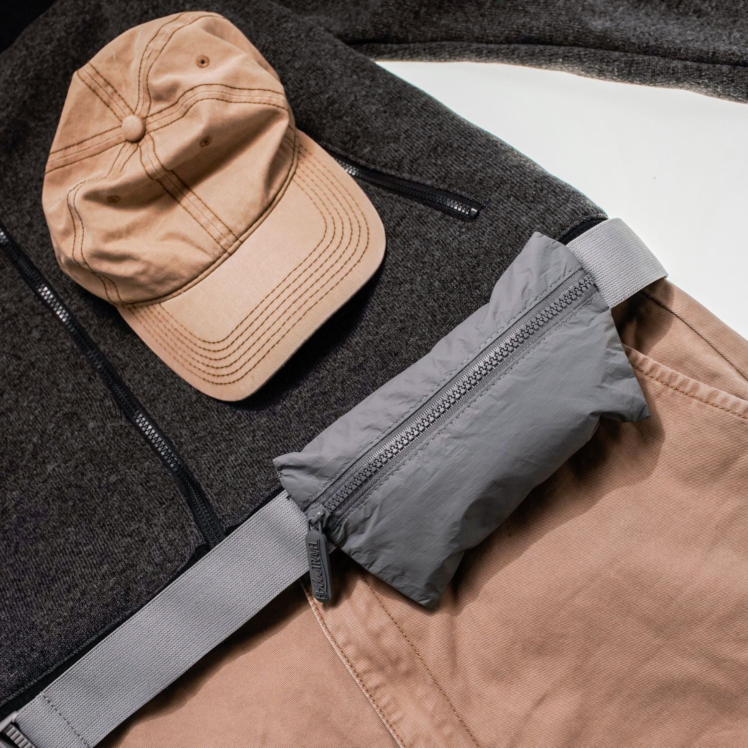 Sweater, hat, pants and Layflat Fanny Pack Belt Bag in Cool Gray on white background