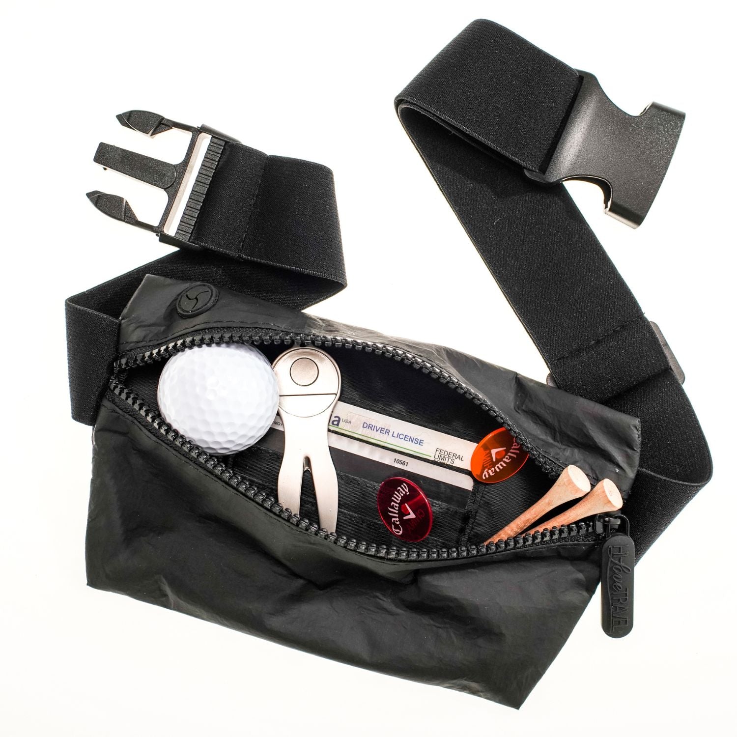 Lay flat fanny pack belt bag in black MAX with golf balls, tees, and ball markers on white background