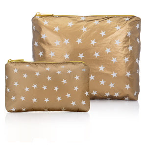 Set of two travel bags set in gold with white stars