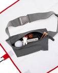 Layflat Fanny Pack Belt Bag in Cool Gray with golf supplies on white background