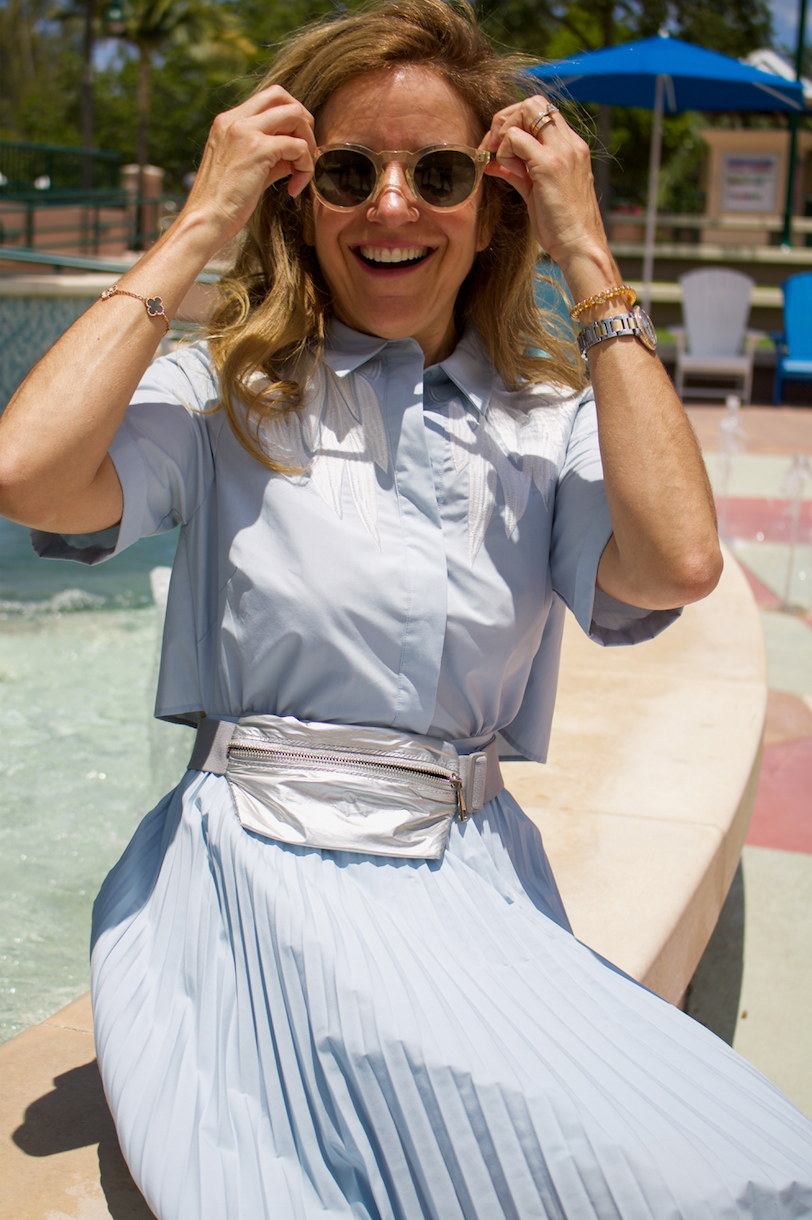 woman smiling wearing fanny pack