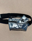 Layflat Fanny Pack Belt Bag in Silver on sand background
