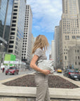 woman carrying medium pack in city setting