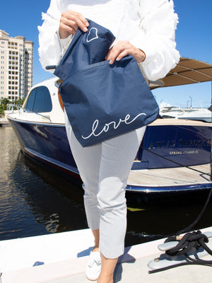 zipper wristlet and clutch in navy with nautical rope