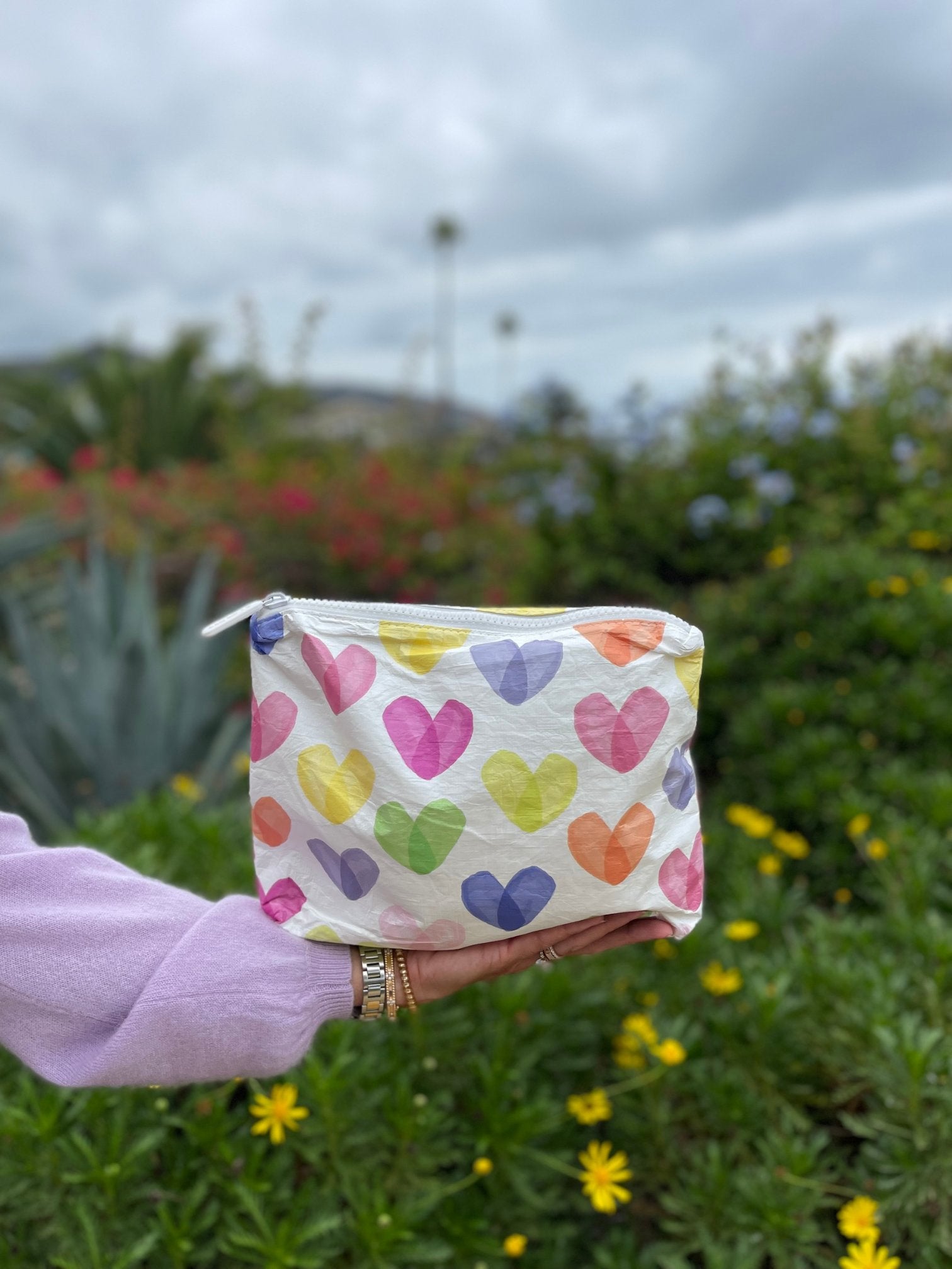 medium zipper pouch with rainbow hearts carries everything you need for spring