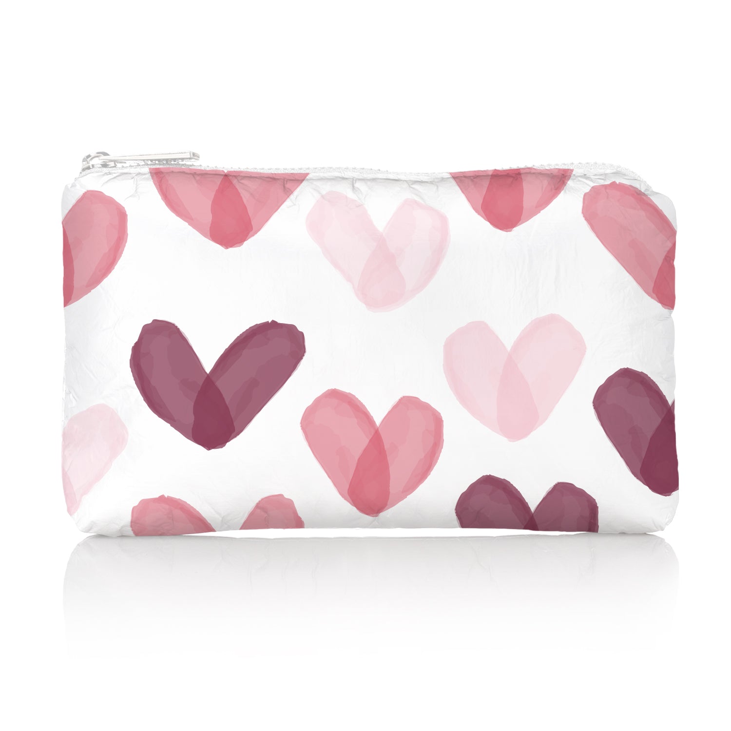 Mini white zipper cosmetic bag with multicolored pink hearts on white background